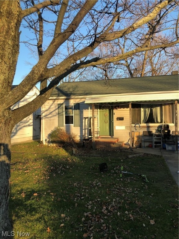 back of house with a yard