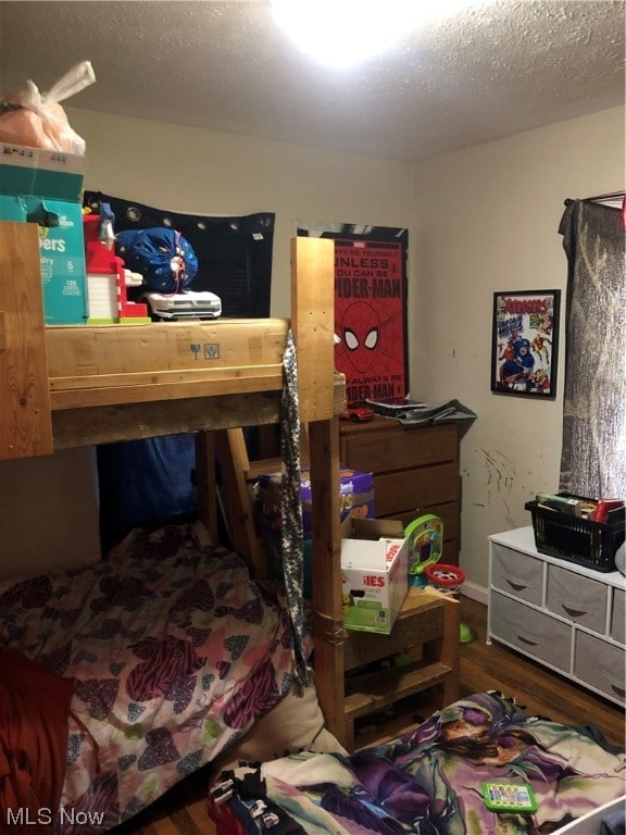 1351 E 340th St, Eastlake, OH 44095 - bedroom with a textured ceiling and hardwood / wood-style floors