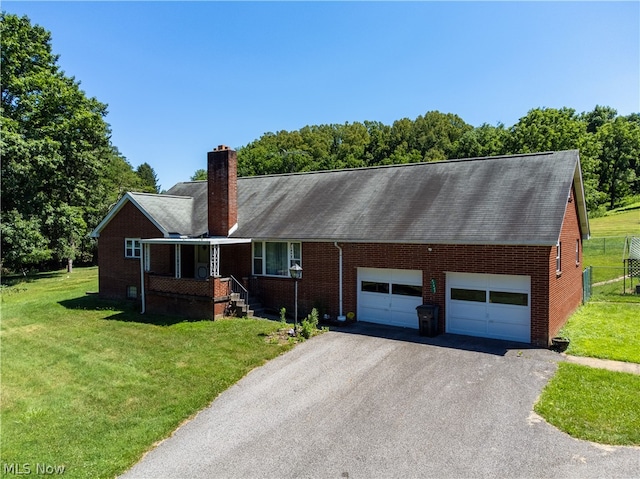 single story home with a garage and a front yard