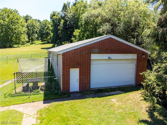 garage with a lawn