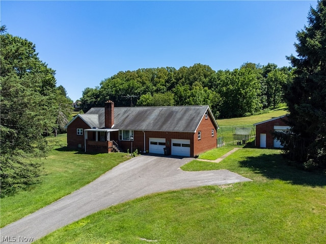 ranch-style house with a garage and a front yard