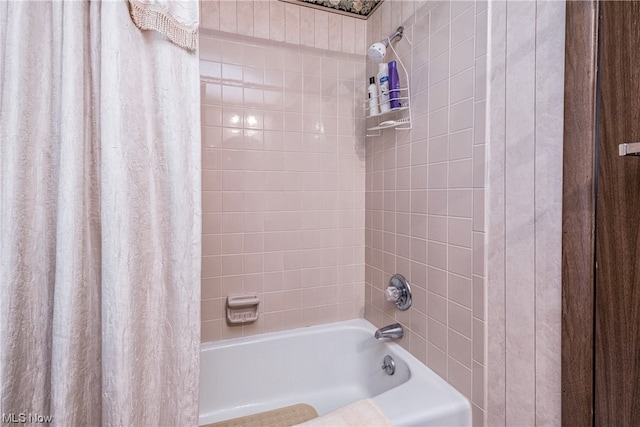 bathroom with shower / bath combination with curtain