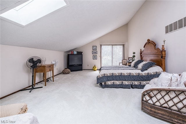 bedroom with light carpet and vaulted ceiling with skylight