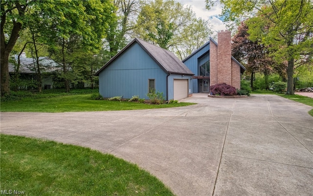 view of front facade with a front lawn and a garage