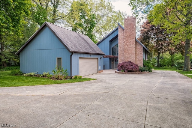 view of side of home featuring a garage