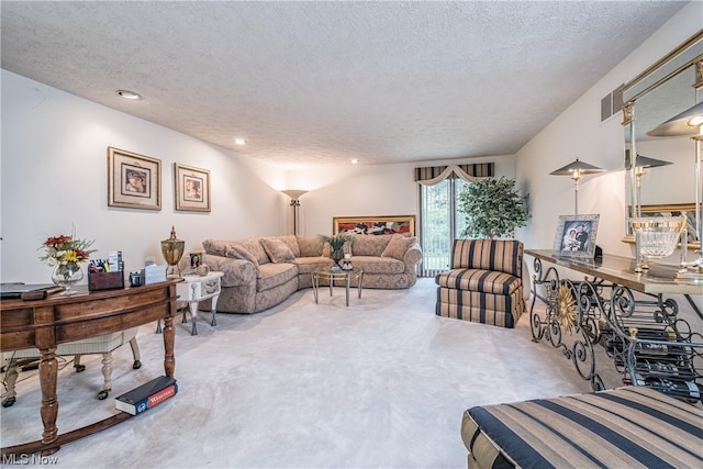 carpeted living room featuring a textured ceiling