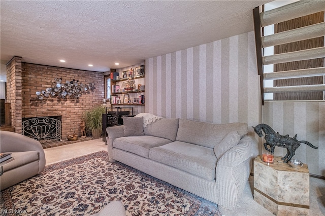 carpeted living room featuring brick wall, a brick fireplace, and a textured ceiling