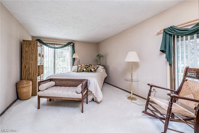 carpeted bedroom with a textured ceiling