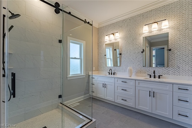 bathroom with dual vanity, tile flooring, tasteful backsplash, a shower with shower door, and ornamental molding