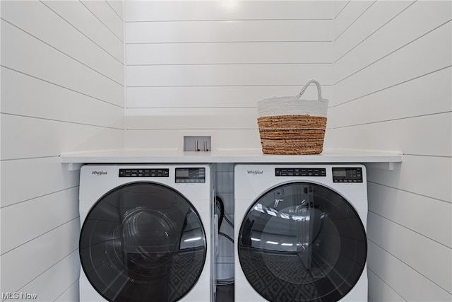 washroom with washing machine and dryer and hookup for a washing machine