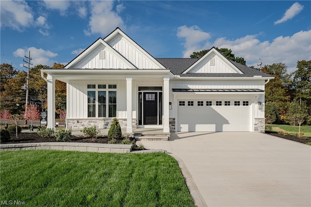 view of front facade with a front lawn and a garage