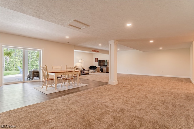 interior space featuring a textured ceiling and light hardwood / wood-style flooring