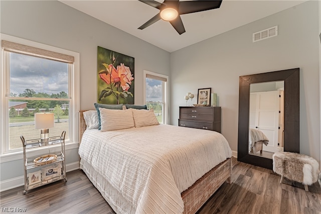 bedroom featuring dark hardwood / wood-style flooring and ceiling fan