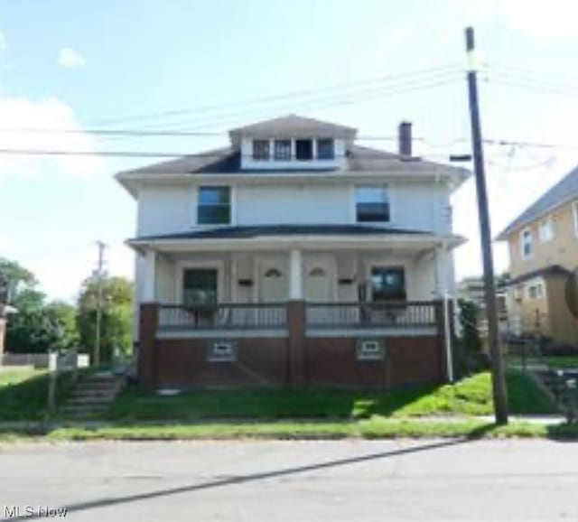 view of property with covered porch