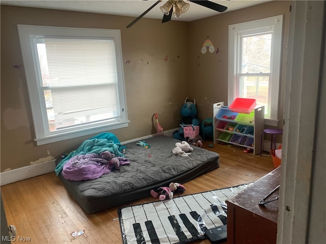 interior space with ceiling fan and light hardwood / wood-style flooring