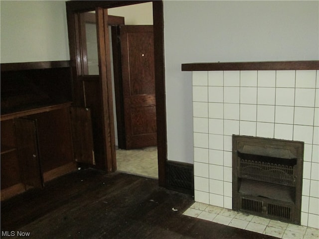 interior space with tile walls and hardwood / wood-style floors