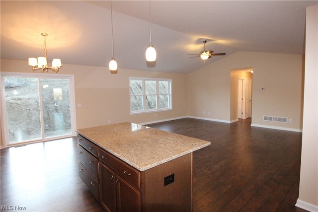 kitchen with vaulted ceiling, decorative light fixtures, dark hardwood / wood-style floors, and ceiling fan with notable chandelier