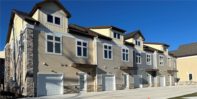 rear view of property with a garage