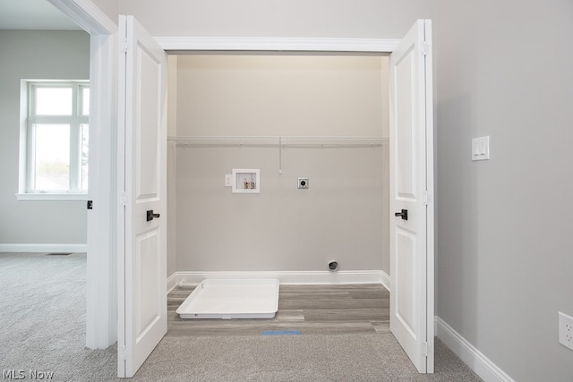 laundry area featuring hookup for a washing machine, hardwood / wood-style flooring, and electric dryer hookup