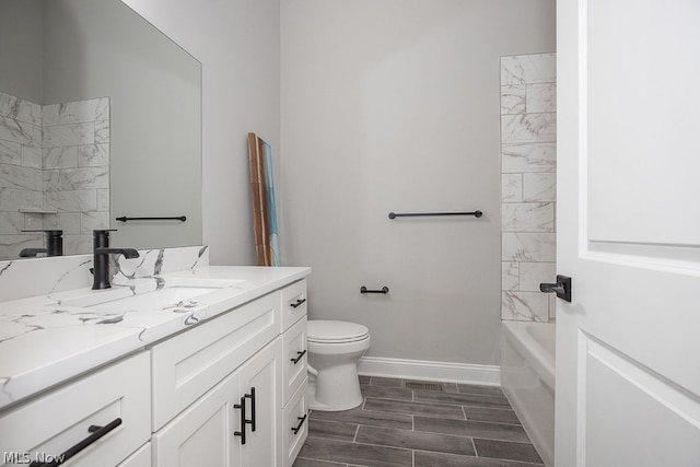 full bathroom featuring tiled shower / bath combo, vanity, toilet, and tile flooring