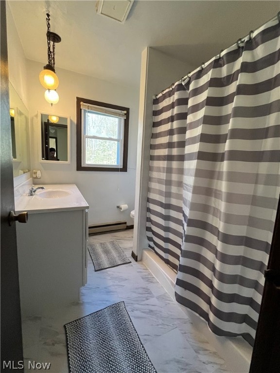 bathroom with a shower with shower curtain, vanity, toilet, and baseboard heating