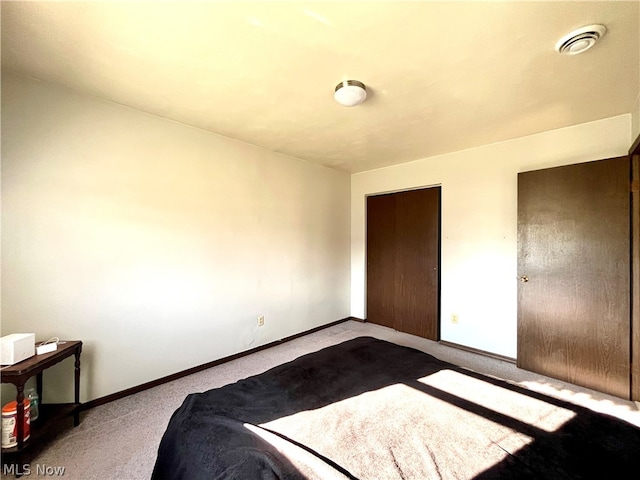 unfurnished bedroom with light colored carpet