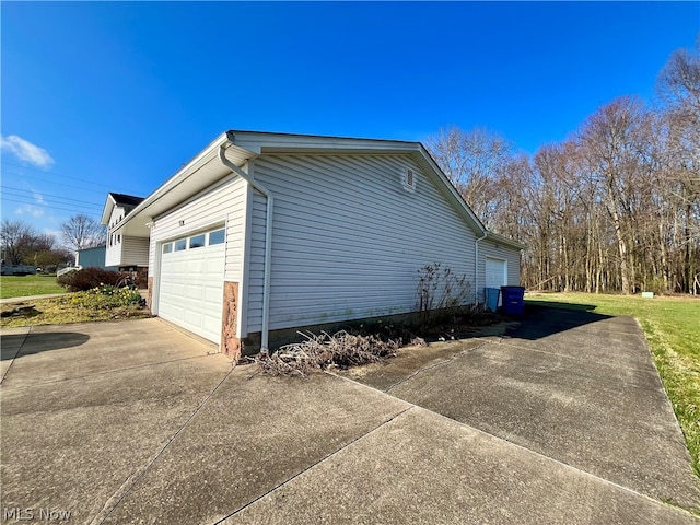 view of home's exterior with a garage