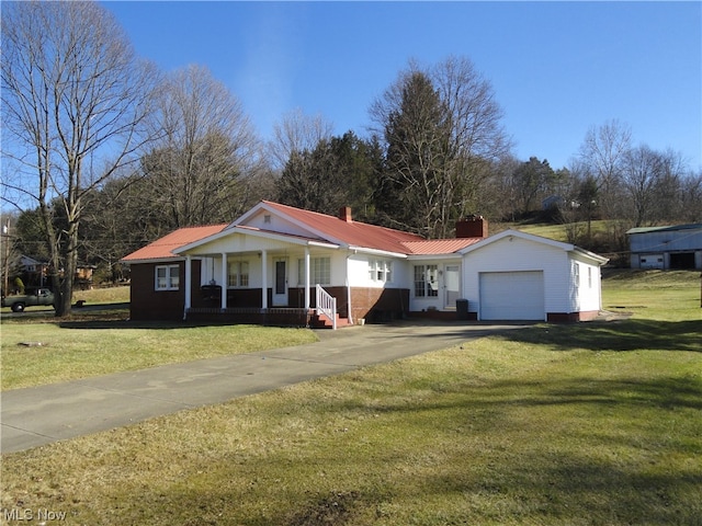 ranch-style house with a front yard, a porch, and a garage