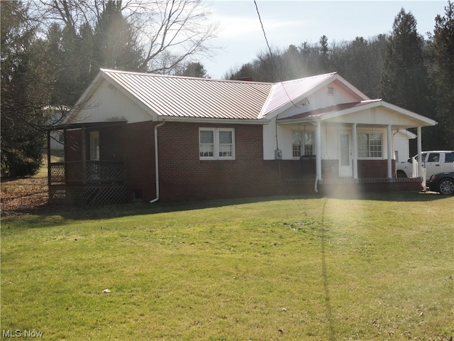 view of front of home with a front yard and a porch