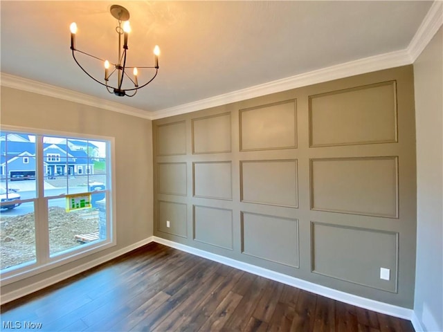 unfurnished dining area with dark wood-style floors, ornamental molding, a notable chandelier, and a decorative wall