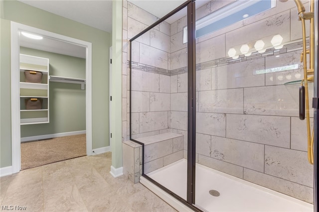 bathroom featuring tile patterned floors and an enclosed shower