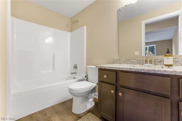 full bathroom with vanity, wood-type flooring, bathtub / shower combination, and toilet