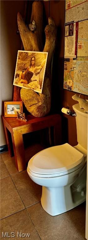 bathroom featuring tile patterned flooring and toilet