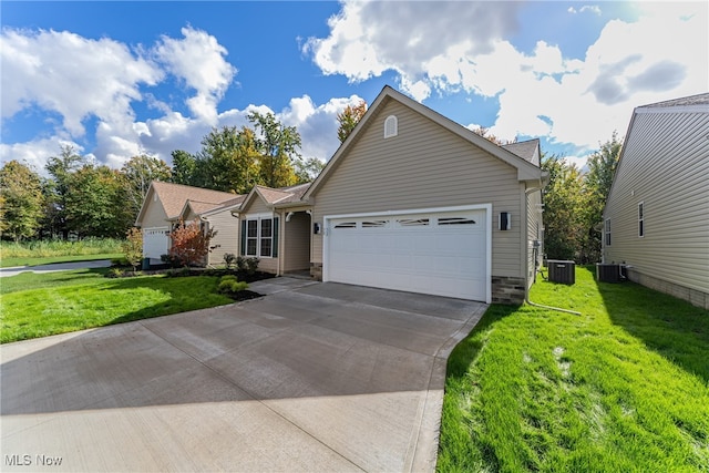 view of front of home featuring a front yard, central AC, and a garage