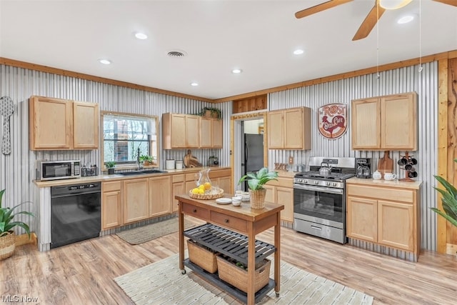 kitchen with black appliances, light brown cabinetry, and light hardwood / wood-style flooring