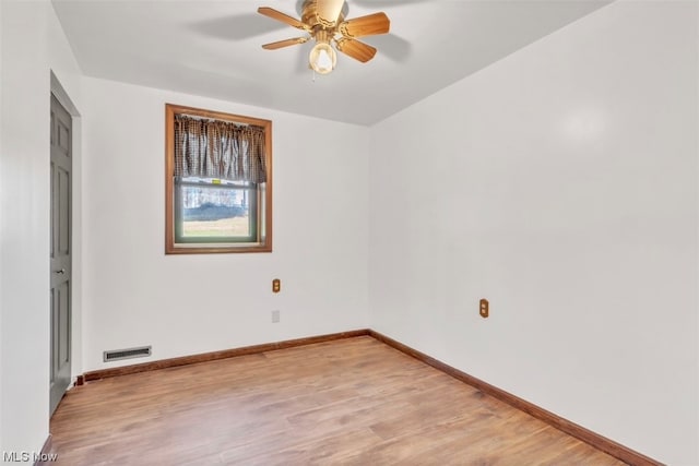 unfurnished room with ceiling fan and light hardwood / wood-style flooring