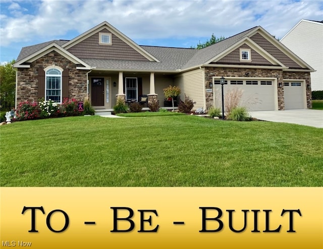 view of front of home featuring a front lawn and a garage