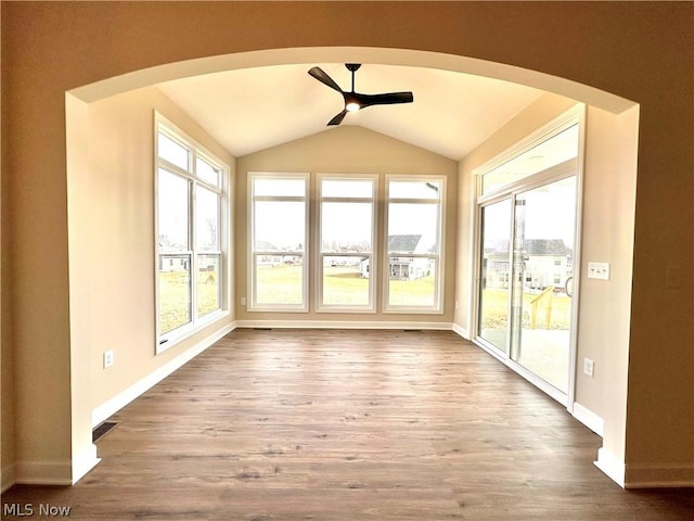 unfurnished sunroom featuring lofted ceiling and ceiling fan