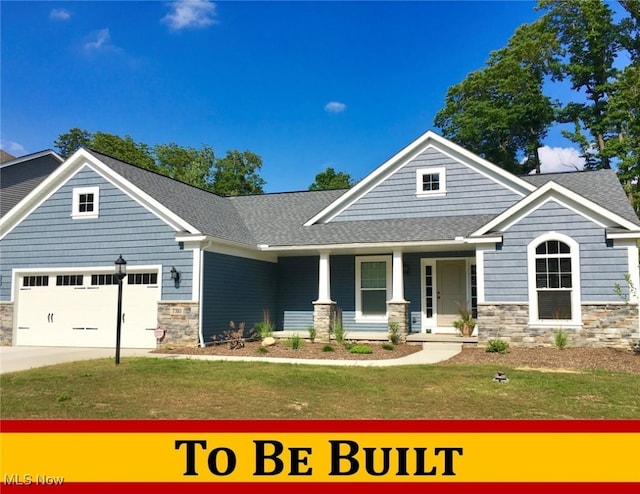 view of front of property featuring stone siding, roof with shingles, and a front yard