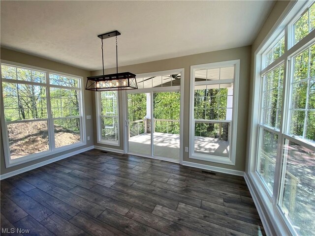 unfurnished sunroom featuring plenty of natural light