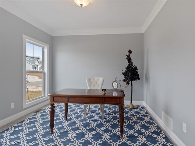 office space featuring carpet flooring, visible vents, crown molding, and baseboards