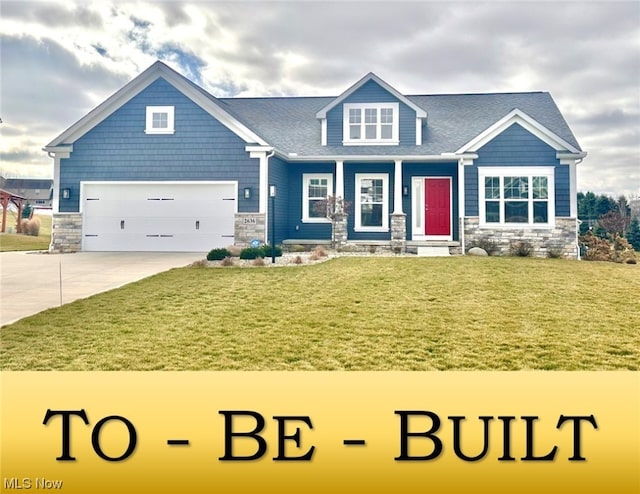 view of front of property featuring a garage and a front lawn