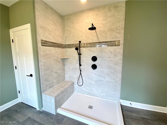 bathroom with a tile shower