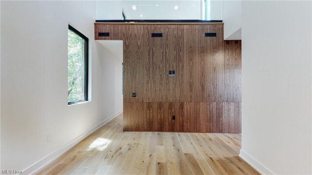 unfurnished room with light wood-type flooring