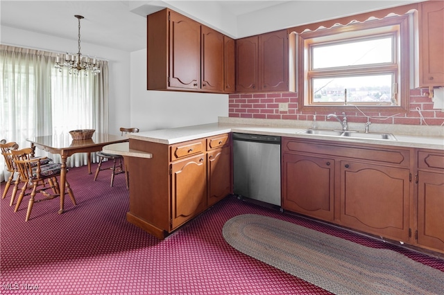 kitchen featuring hanging light fixtures, dishwasher, an inviting chandelier, sink, and dark carpet