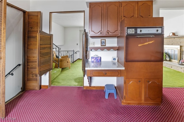 kitchen with carpet flooring