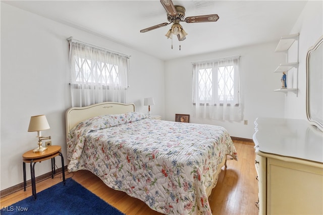 bedroom featuring hardwood / wood-style floors and ceiling fan