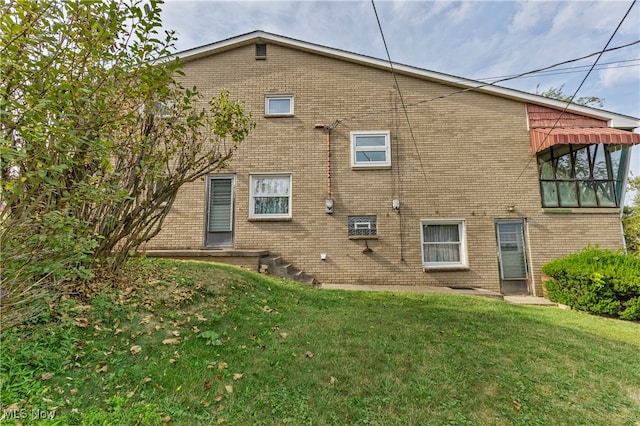 view of side of home featuring a lawn