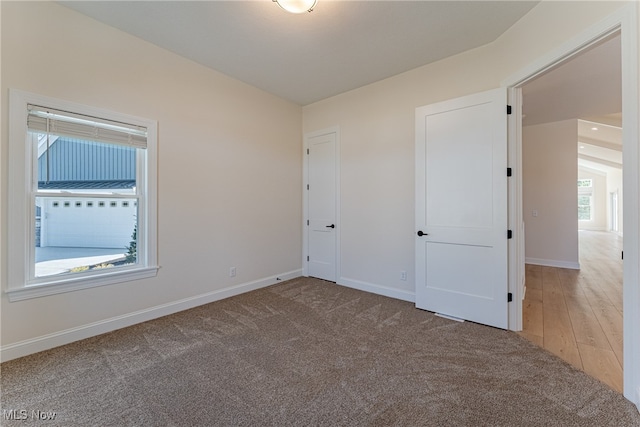 unfurnished room with wood-type flooring