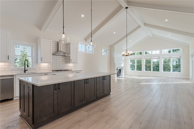 kitchen featuring a wealth of natural light, sink, and light wood-type flooring